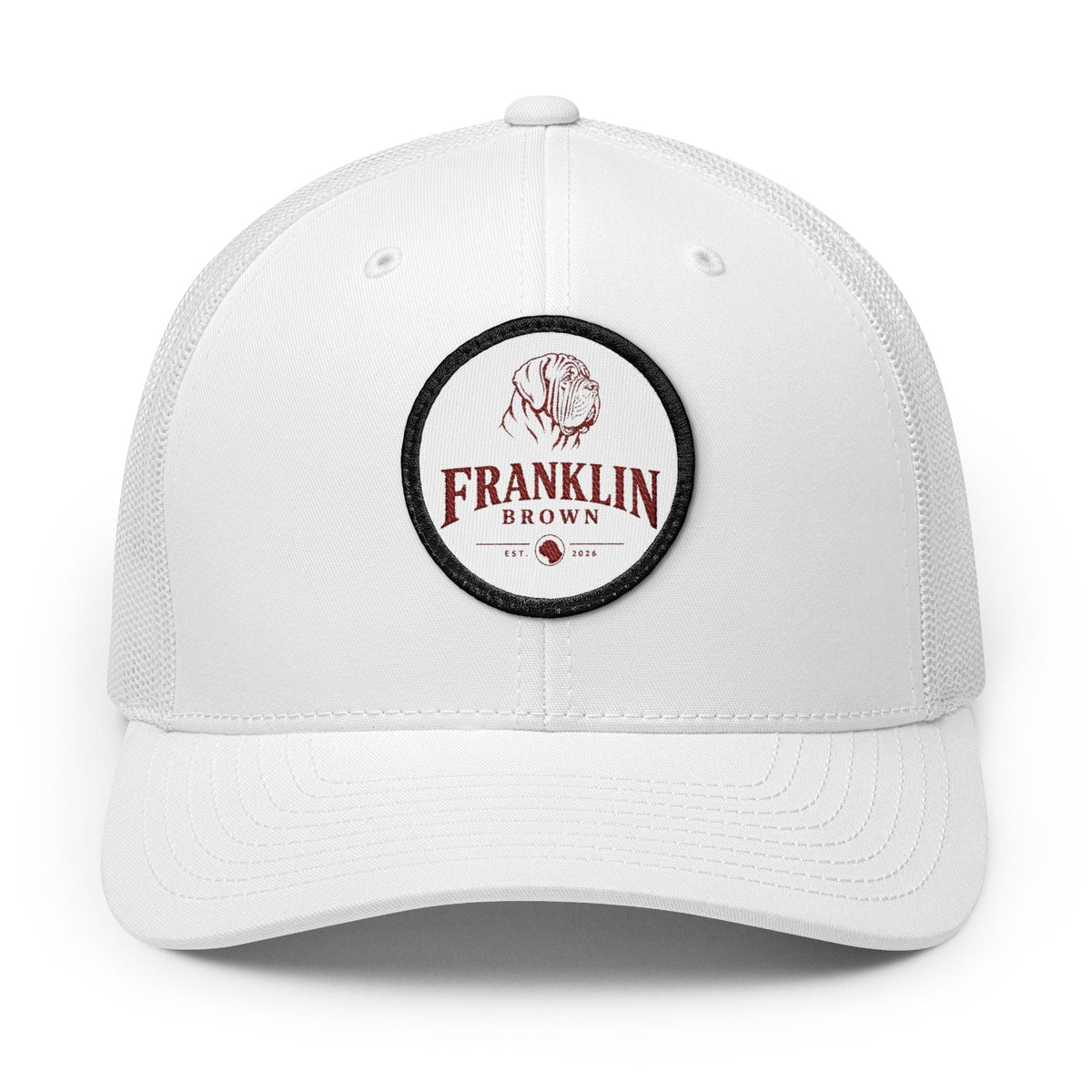 White mesh trucker cap with adjustable snapback closure, featuring a circular logo patch with a dog illustration and 'Franklin Brown' text