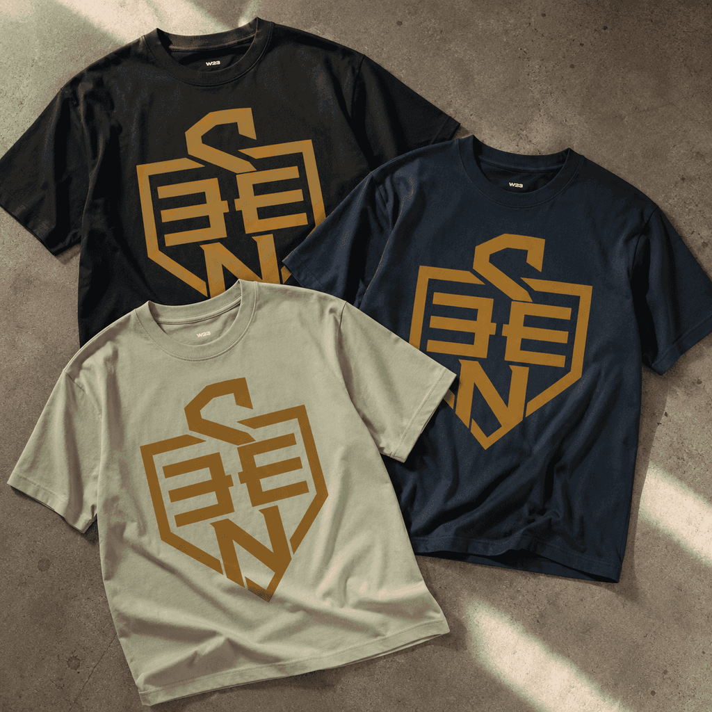 SEEN Shield Logo Tee — Gold Emblem Graphic T-Shirt