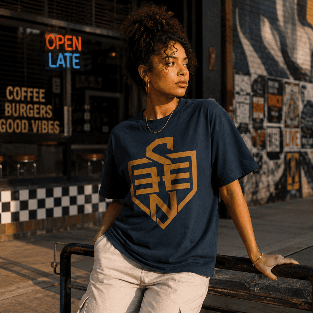 SEEN Shield Logo Tee — Gold Emblem Graphic T-Shirt