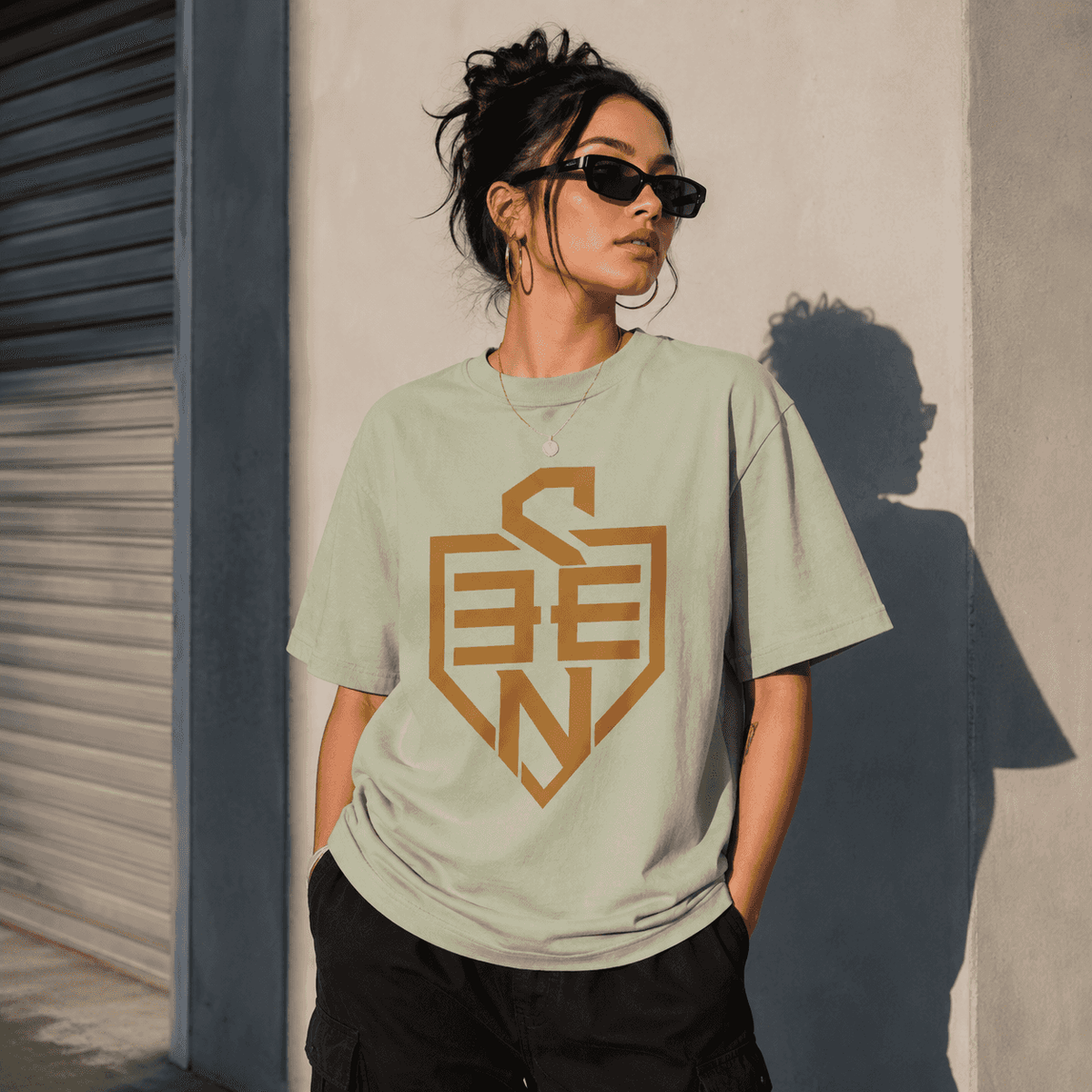 SEEN Shield Logo Tee — Gold Emblem Graphic T-Shirt
