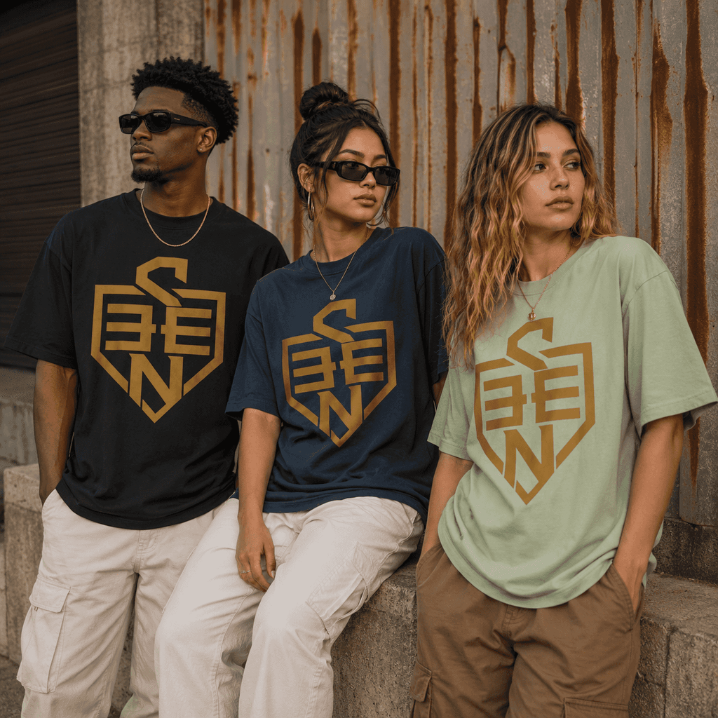 SEEN Shield Logo Tee — Gold Emblem Graphic T-Shirt